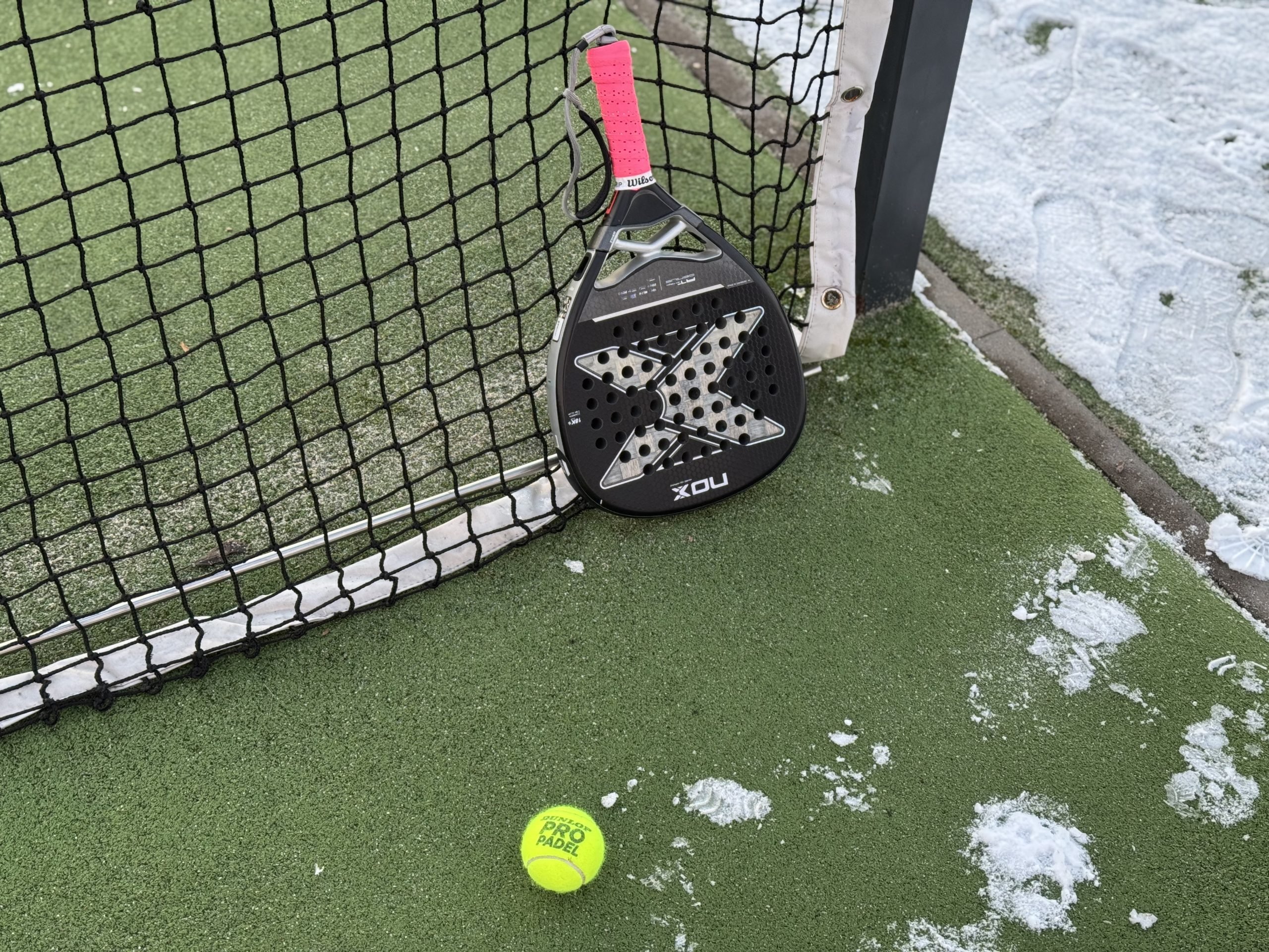 Kyiv, ukraine – january 12, 2025 A tennis padel court covered in the snow, sport cancelled due to inclement weather. paddle racket nox