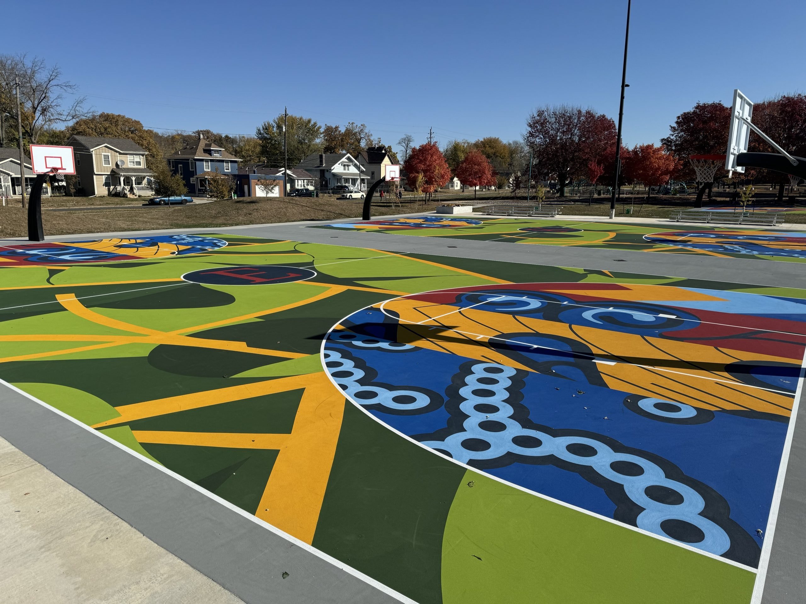 Vibrant multipurpose basketball court mural in Evelyn K. Davis Park, Des Moines