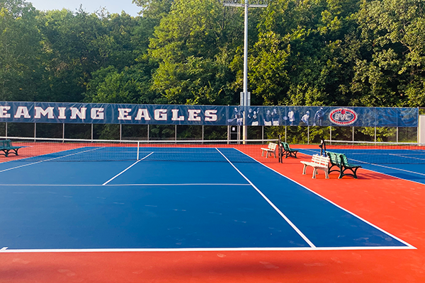 evitalized tennis courts at the University of Southern Indiana, resurfaced by Pro Track and Tennis with fresh color coating and striping for enhanced performance and appearance.