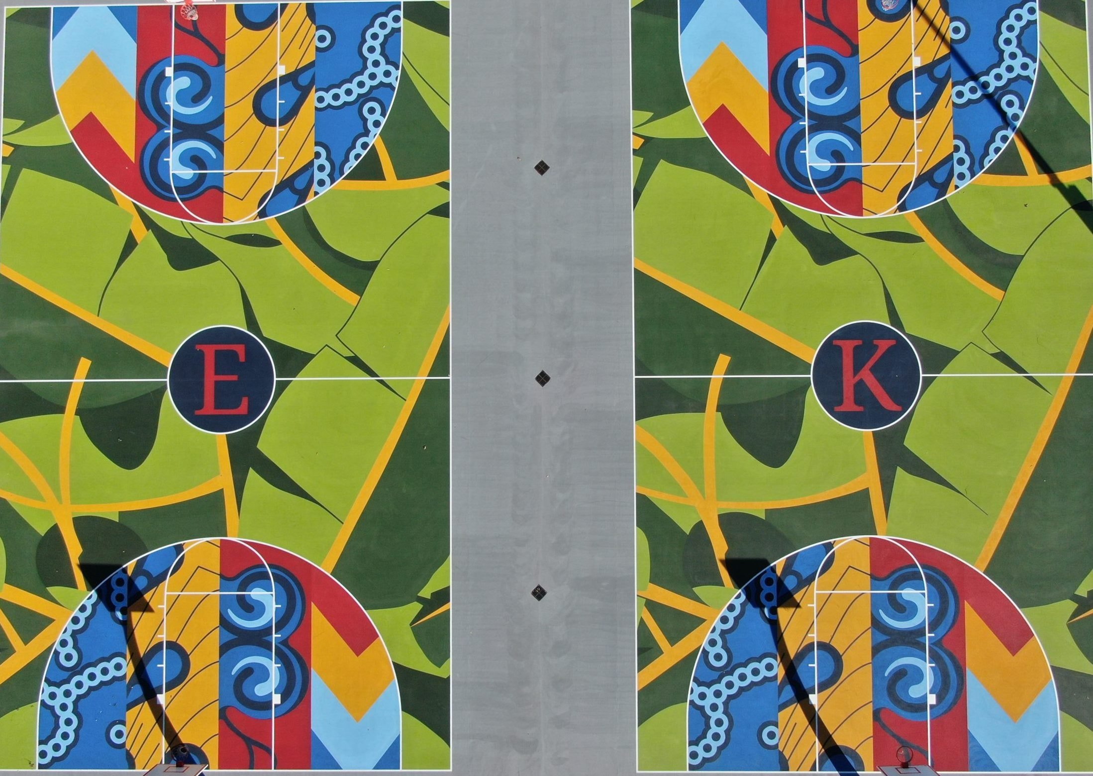 Newly renovated basketball courts designed to reflect local culture and history, created with community input to foster pride and provide a vibrant recreational destination