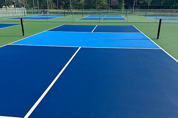 Close-up view of a newly painted pickleball court