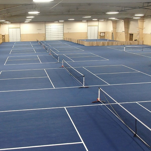 Recreational pickleball courts with nets and boundary lines