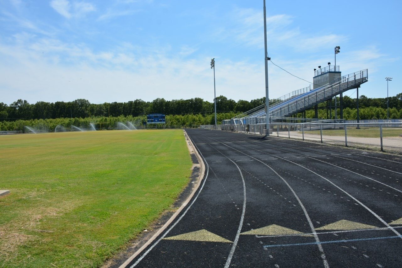 School running track and stadium viewed during off-season conditions.