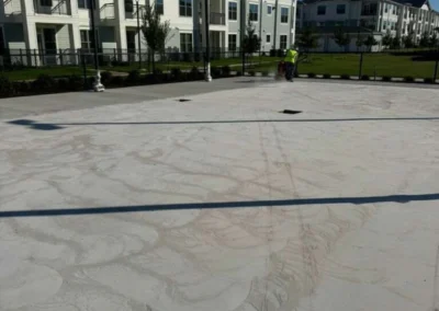 Concrete surface preparation underway for residential pickleball courts in Baytown, TX